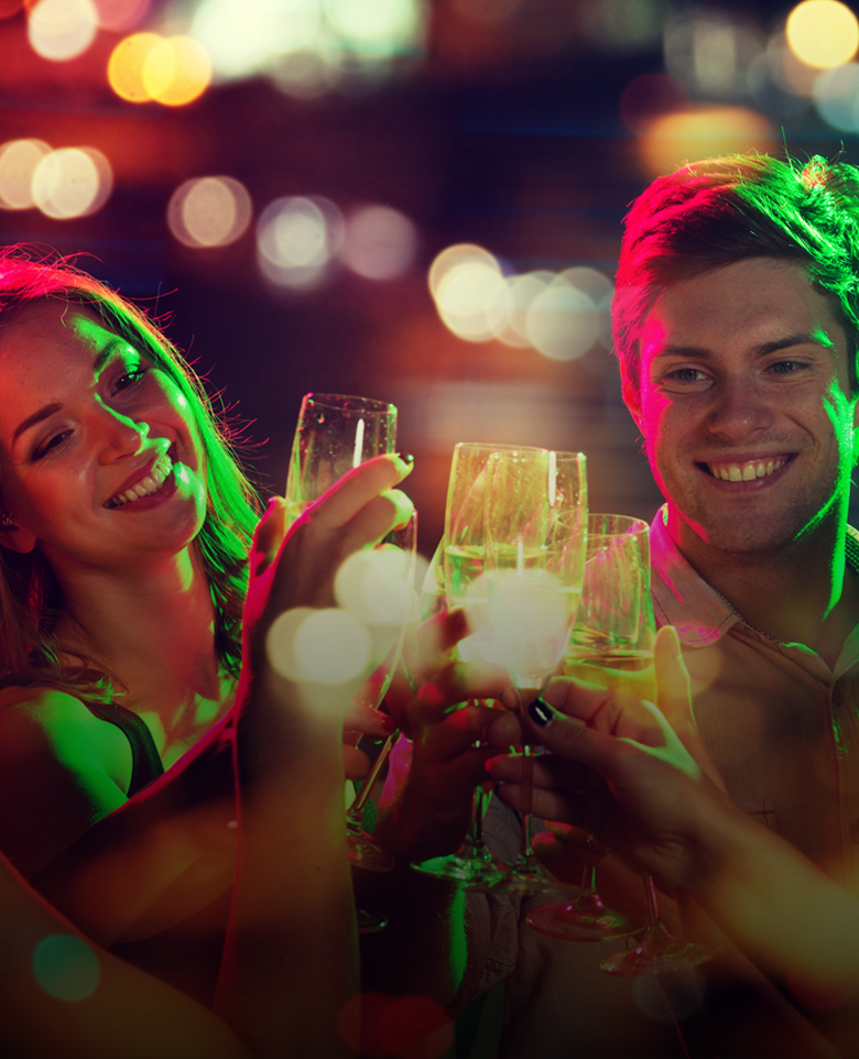 two people holding glasses