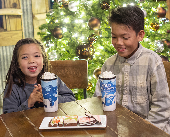 Two kids enjoying winter treats